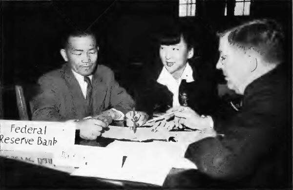 Japanese being interviewed by a representative of the Federal Reserve Bank