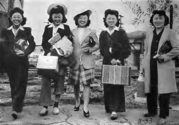 Group of young Japanese girls arriving at a Long Beach, California railroad station