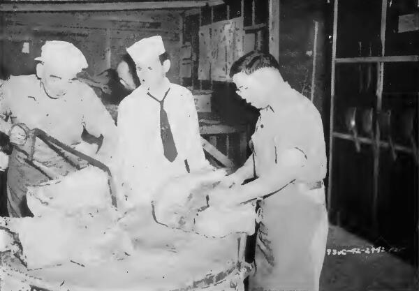 Evacuee meat cutters at work at Turlock (California) Assembly Center