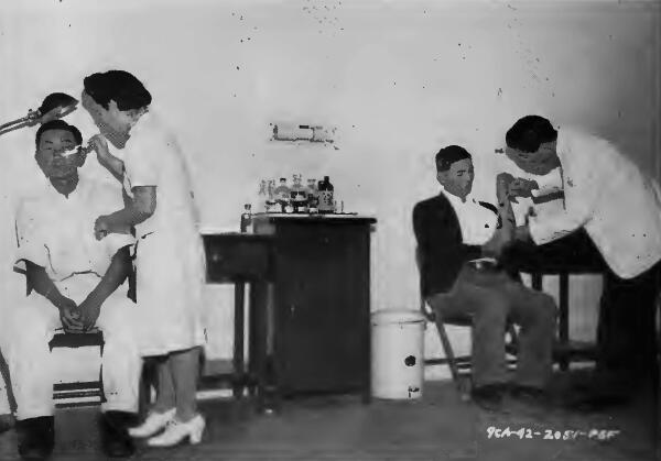 First-aid treatment for superficial cuts and bruises being administered at the Santa Anita (California) Assembly Center
