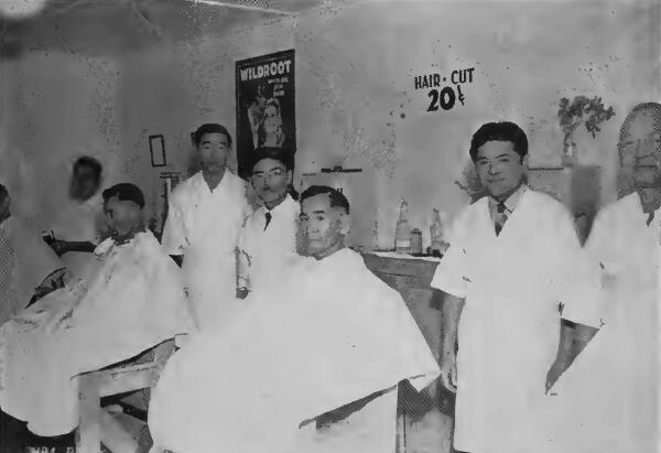 One of two 12-chair barber shops at Santa Anita (California) Assembly Center