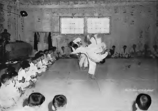 A group of young evacuees receiving instruction in Jiu Jitsui, or Judo wrestling, at Portland (Oregon) Assembly Center