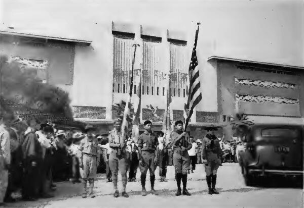 A Boy Scout Color Guard leading a parade at a celebration in Santa Anita (California) Assembly Center