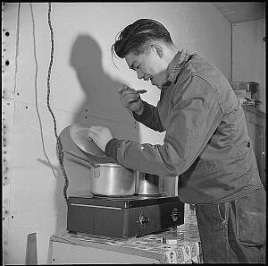 Cooking at home, Manzanar, 1943