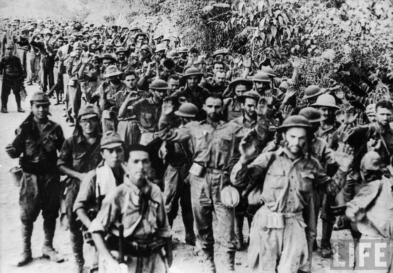 American prisoners marching alongside Japanese captors after the fall of Corregidor during WWII 1942-5-6